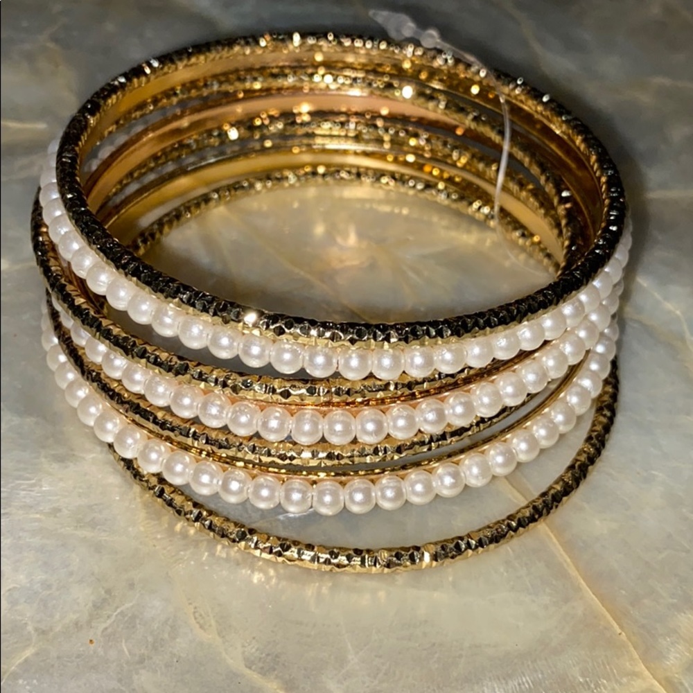 Pearl and gold bangles